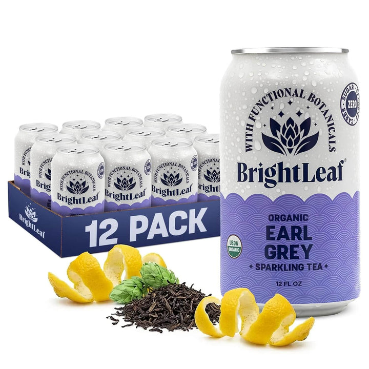 BrightLeaf Organic Earl Grey sparkling tea can and 12-pack box with tea leaves and lemon slices on a white background.